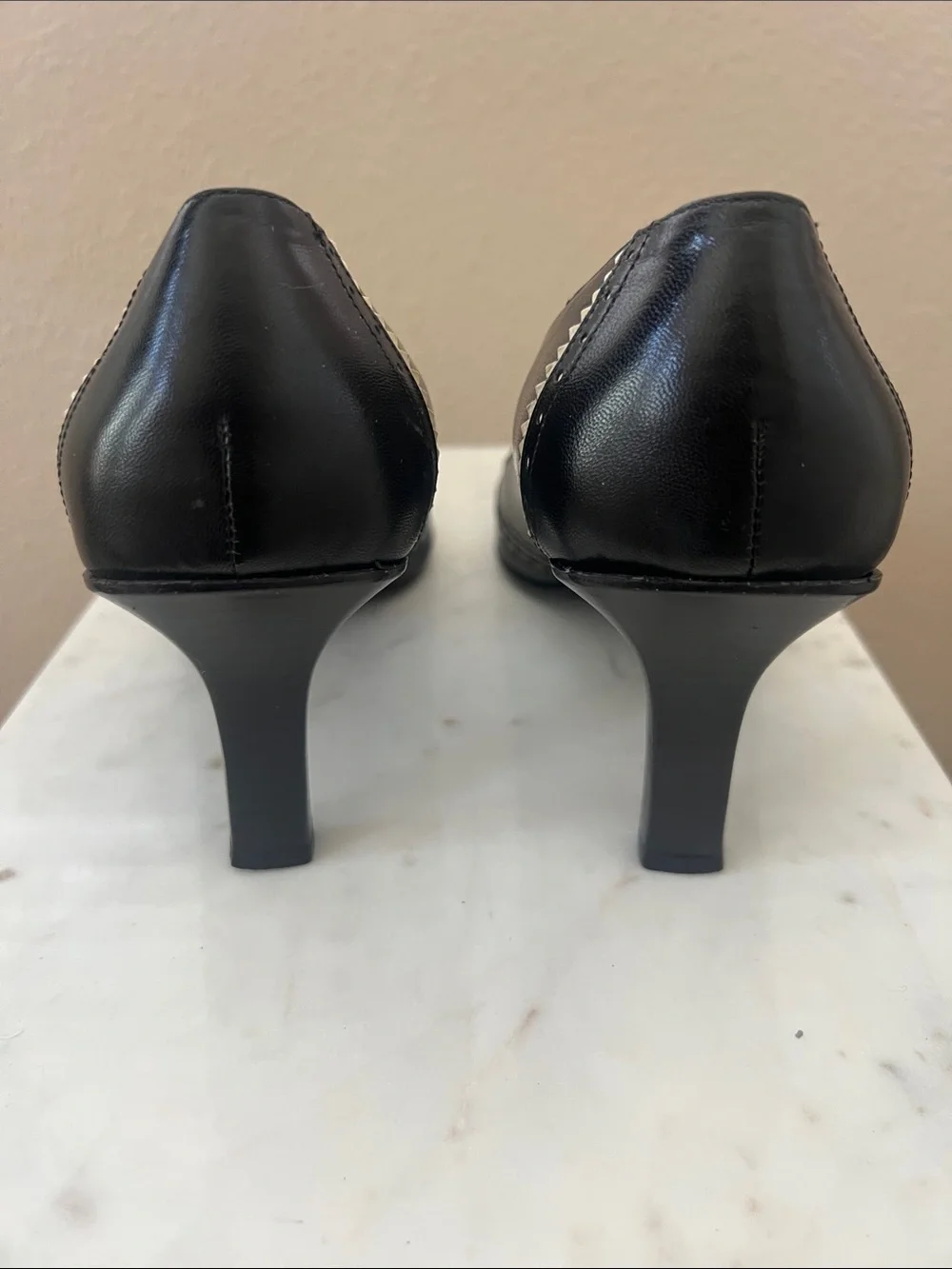Coach Black Leather Pointed Toe Heels with Metallic Accent